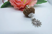 12 Mukhi Rudraksha Pendant with Surya Symbol in Silver - Spiritual Jewelry for Leadership & Clarity by Brahmatells